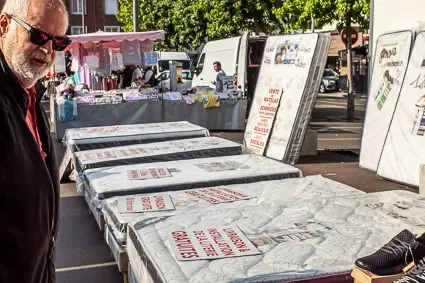 Mattress and bed vendor in Beauvais public market