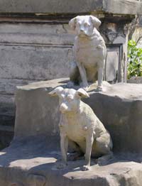 Statues of two dogs at Le Cimetière des chiens d'Asnières-sur-Seine near Paris
