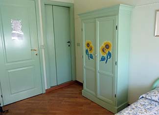 Painted armoire in Hotel Lilium room
