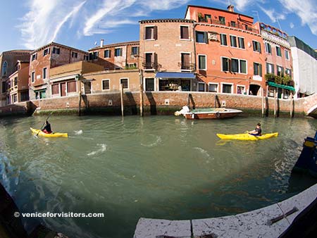 Kayaks on a canal in Venice, Itlay