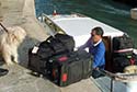 water taxi driver with luggage at low water