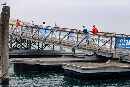Venice Marathon runners on temporary bridge over the Grand Canal