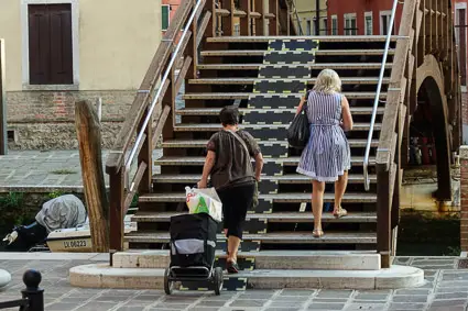 Bridge in Cannaregio, Venice, Italy with wedges for shopping carts