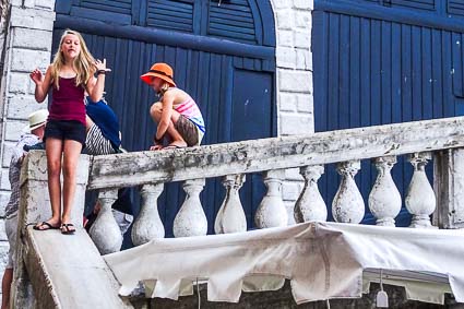 Girl on balustrade of Rialto Bridge, Venice