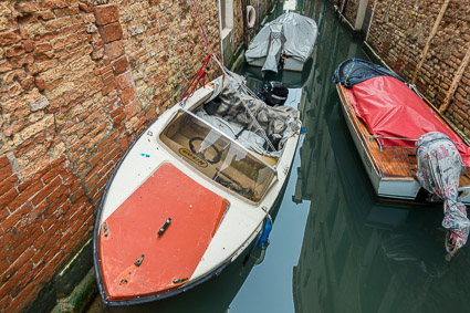 Boat in tiny Venice canal