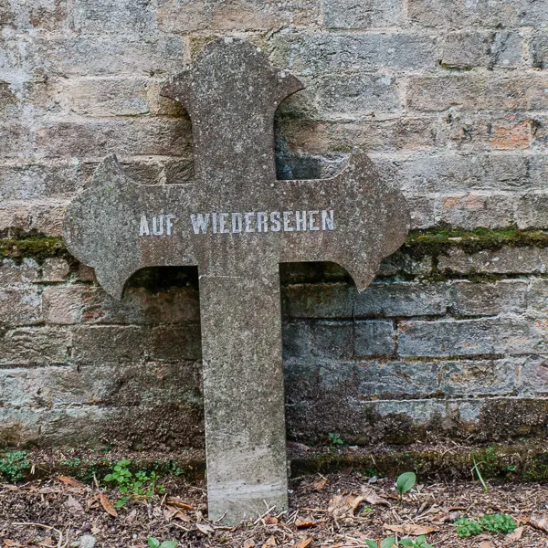 'Auf Wiedersehen' marks the grave of an unknown guest in Venice's San Michele Cemetery.