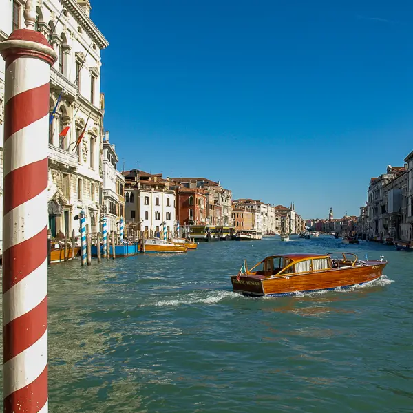 A water taxi cruises on Venice's Grand Canal.