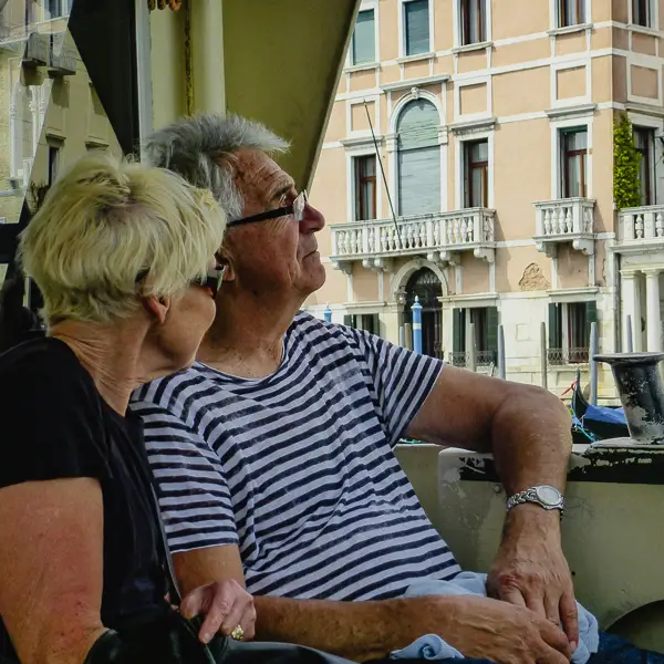 Visitors admire the views from a No. 1 vaporetto on Venice's Grand Canal.
