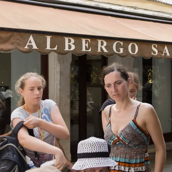 Two young woman pass the Albergo San Zulian near Venice's Piazza San Marco.