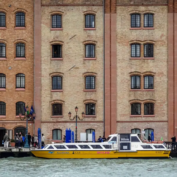 A shuttle boat delivers passengers to 