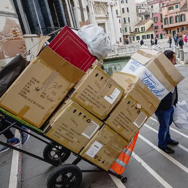 In Venice, deliveries are made by boat and handcarts instead of trucks.