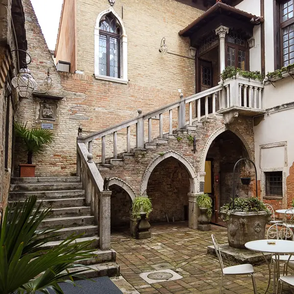 The Hotel Ca' Nobili Corner occupies a palazzo with a courtyard.