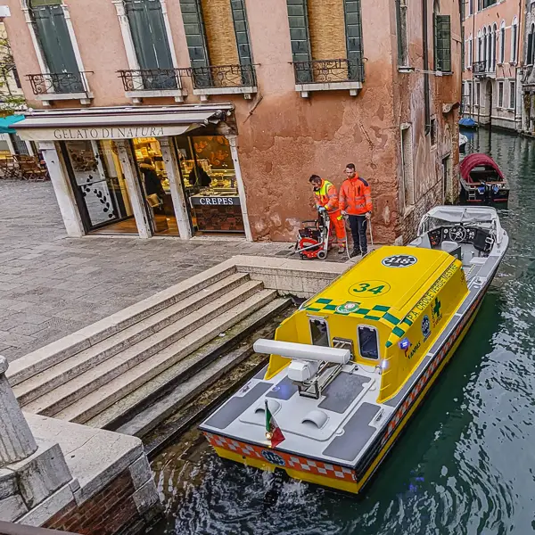 Visitors share a kiss on the Accademia Bridge in Venice, Italy.