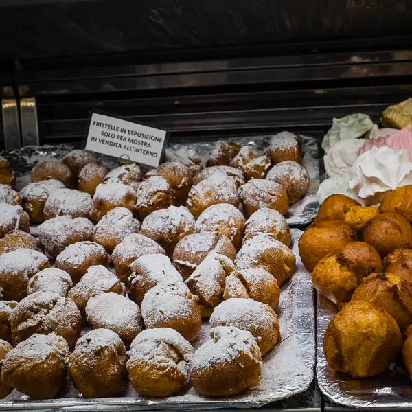  Frittelle fill a store window in Venice. These fritters are traditionally sold during Carnival, but they're easy to find throughout the winter months.