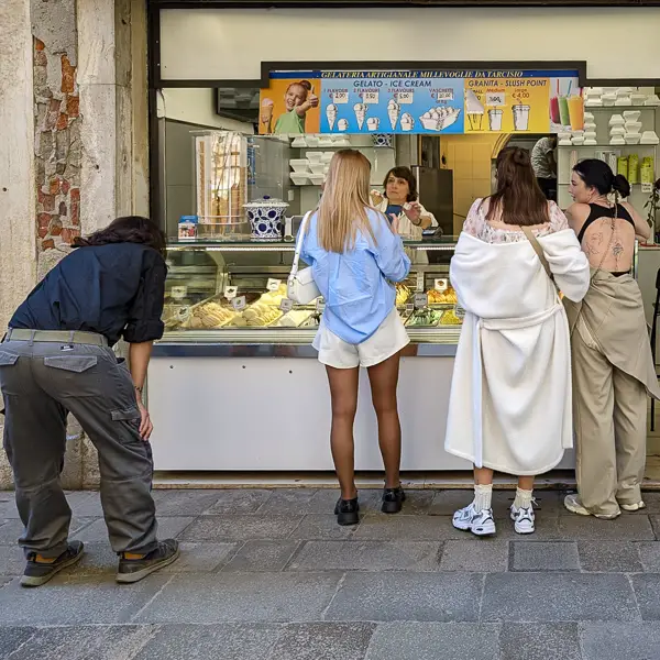 A man inspects the gelato case at Millevoglie next to the Frari Church in Venice, Italy.