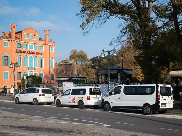 Land taxis await passengers in the Piazzale Roma, the automotive gateway to Venice's historic center.