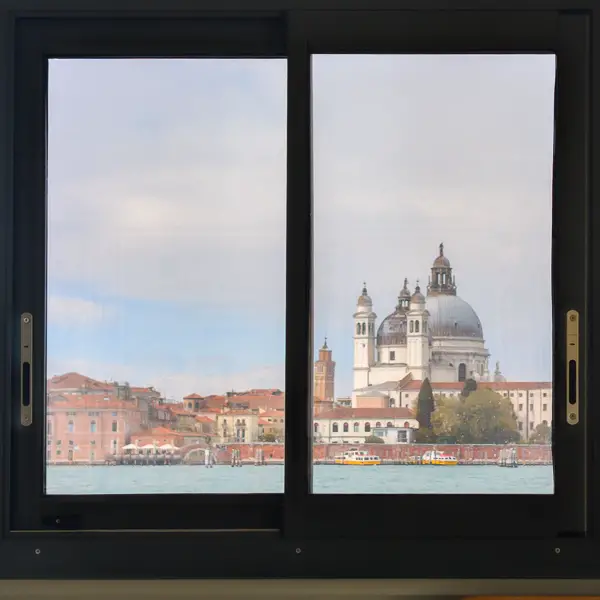 This photo of the Basilica di Santa Maria della Salute was taken through a window in a pontile, or floating station platform, at an ACTV waterbus stop on Venice's island of Giudecca.