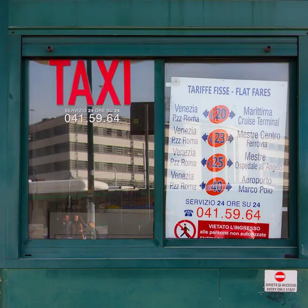 This sign at the Piazzale Roma's taxi stand shows flat rates to (or from) Venice Marco Polo Airport and other major transportation points in the area.