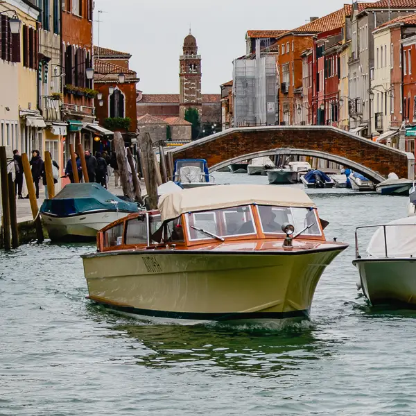 A family enjoys the view from a vaporetto on Venice's Grand Canal.