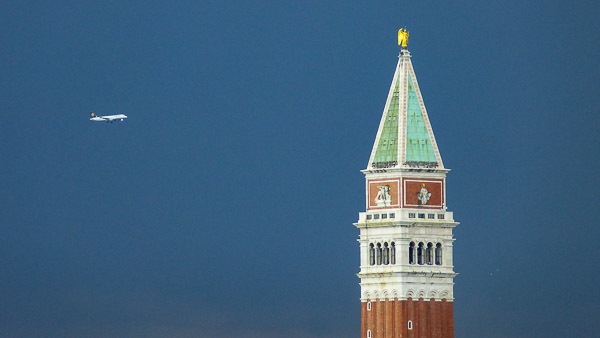 Lufthansa airliner arriving in Venice with Campanile di San Marco