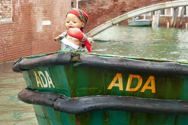 Figurehead doll on a boat in Venice, Italy.
