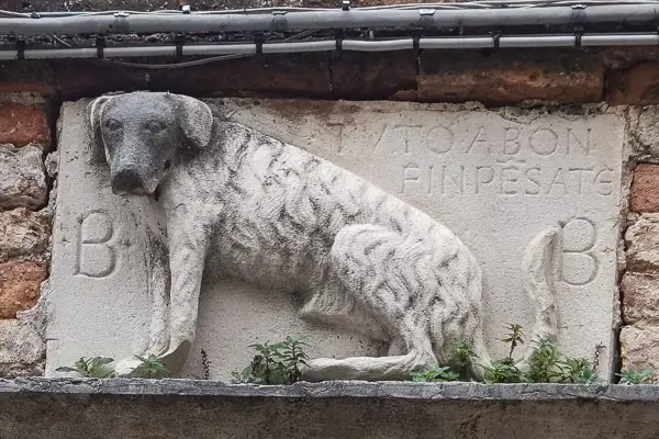 Bas relief dog in Venice, Italy.