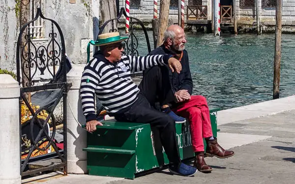 Gondolier and friend in Venice, Italy.