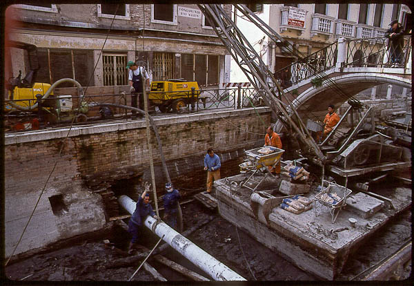 Utility pipe installation in a drained Venice canal, 1999