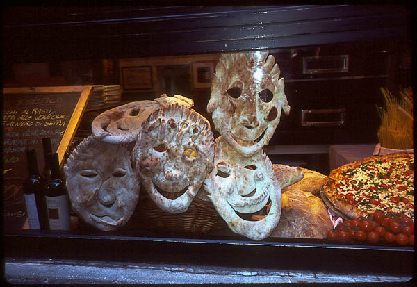 Pizza faces in restaurant window, Venice, 1999