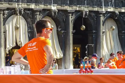 Bartender with Aperol Spritzes