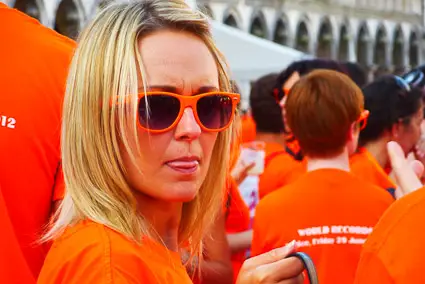 Blonde woman in Aperol gear, Venice, Italy